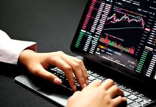 Forex trading terms and definitions on a digital screen with charts and financial symbols